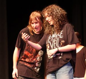 Alyssa Garland, right, performs with Levi Stahl on stage at the Summer Academy.