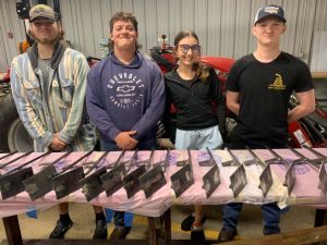 Left to right, North Greene FFA students Cody Duvall, Blake Hurd, Kinslee Sauceman and Larry O’Neal stand by stakes they created for the arboretum signs.