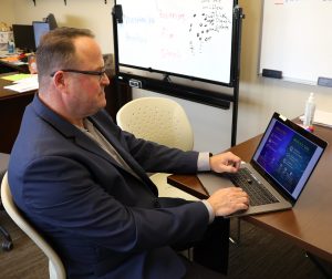 David Hite reviews a presentation on artificial intelligence.