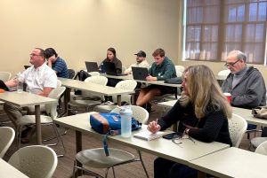 Tusculum students, staff and faculty members participate in an AI training session.