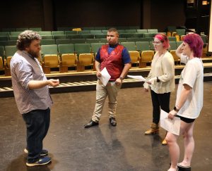 Steve Schultz, left, speaks with, left to right, James Sams, Emme Foster and Lily Burgner during auditions for “The Taming of the Shrew.” All three landed roles.