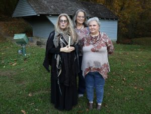 Those connected with one play pose for a photo prior to a performance at the 2023 edition of “Edgar Allan Poe and Other Haunted Stories in the Woods.”