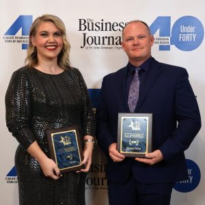 Erin Frizzell, left, and the Rev. E.J. Swatsell hold their awards after the ceremony.