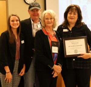 Left to right, Belle Kemp, Bob Kleinertz, Carolynn Kinser and Dr. Tricia Hunsader pose after Dr. Hunsader received her award.