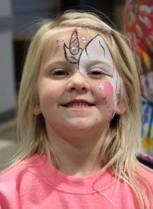 This girl enjoyed having her face painted.