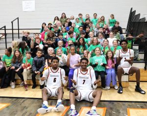 Men’s basketball players have fun with the 6-7 craze with Tusculum View Elementary students.