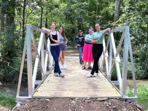 Tusculum University students show the new bridge. They are, left to right, Sage Clapp, AnnaLee Simpson, Rusty Thompson, Mirissa Walters and Kyra Klouzek.