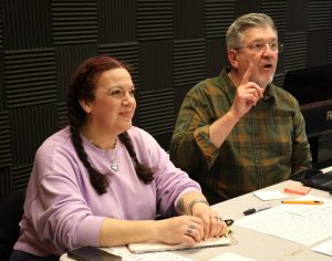 Erin Hensley Schultz, left, and David Gipson evaluate vocal auditions.