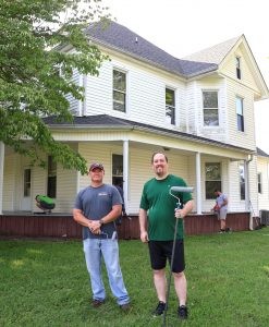 Dr. David Cook, right, and the Rev. E.J. Swatsell stand in front of the male house of the Discipleship Living-Learning Center.