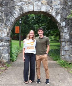 Abbi Douglas, left, and Rio Little stand in front of the Tusculum Arch.