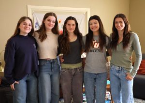 Left to right, Danielle Dugger, Analise Kotynski, Abby Counter, Jasmine Johnson and Kieley Smith, who are five of the residents in the female house, pose inside.