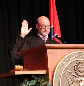 U.S. District Judge Clifton Corker administers the oath of allegiance to the 101 people who became U.S. citizens.