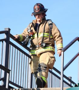 A firefighter prepares to descend steps during the stair climb.