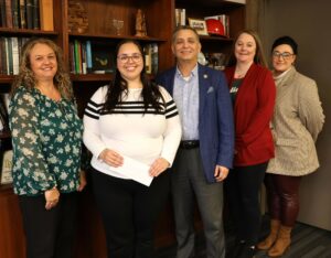 Kayla Yates receives her check from the university. Left to right are Kim Collins, Kayla Yates, Dr. Scott Hummel, Carrie Maggert and Kimberly Cordial.