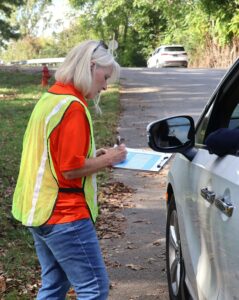 Starr Hummel, Tusculum University’s first lady, checks in a community member at Chuckey-Doak Middle School.
