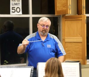 Chris Chambers conducts at a recent rehearsal for the Tusculum University Community Band.