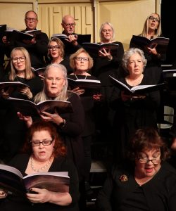 Chorus members rehearse as they prepare for the Christmas concert.