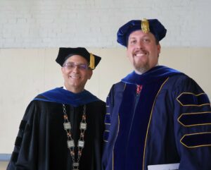 Dr. Scott Hummel, left, Tusculum’s president, and Dr. David Cook, the university’s provost and vice president of academic affairs, enjoy a relaxing moment before the start of the Opening Convocation.