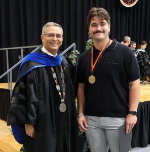 Dr. Scott Hummel, left, presented the President’s Award to student Nehemiah Storey.