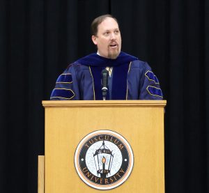 Dr. David Cook, provost and vice president of academic affairs, highlights achievement during his comments at Opening Convocation.