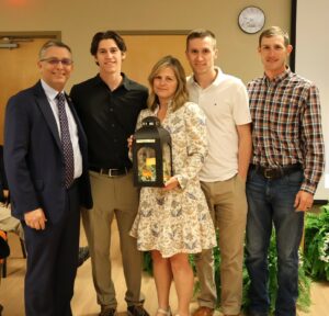Dr. Scott Hummel, left, presents a lantern to the Bowlin family. They are left to right, Jonathan Bowlin, Tammy Bowlin, David Bowlin and Charlie Bowlin.