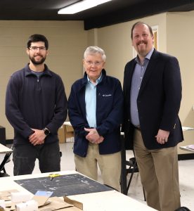 Left to right, Benjamin Conley, Clem Allison and Dr. David Cook celebrate the donation and work completed on the two art laboratories.