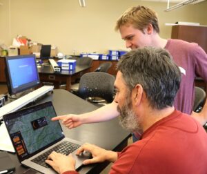 Dr. Chuck Pearson, left, and student Joseph Medeck look at the website for NASA Eclipse Explorer and see how the sun is expected to appear at 3:09 p.m. Monday, April 8.