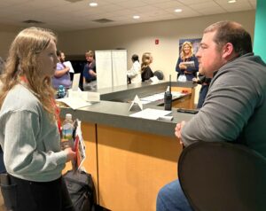 Kirsten Sadlon, left, meets with a vendor.