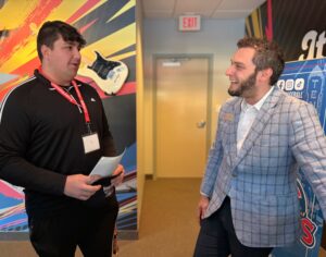 Jacob Nealon, left, meets with a vendor.