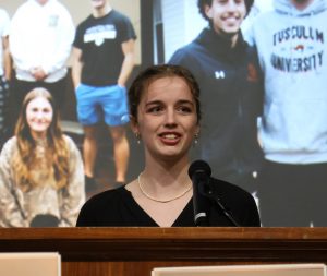 Student Ana Kotynski gives her remarks.