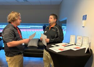 Dr. Brandon Hudson, right, meets a potential student.