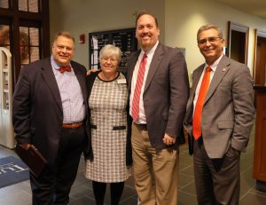 Left to right, Edward Roberts, Kathy Hipps, Dr. David Cook and Dr. Scott Hummel enjoy the occasion.