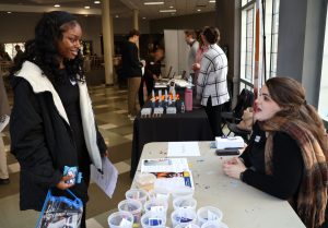Kialia Claiborne, left, meets with one of the vendors.