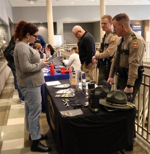 Janelle Zirger, left, meets with troopers from the Tennessee Highway Patrol.