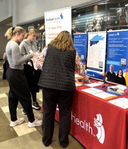 Tusculum students Morgan Browne and Olivia Browne visit the Ballad Health booth. Photo by Tusculum student Landry Tea