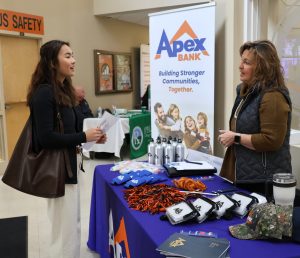 A student learns more about Apex Bank.