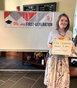 Tusculum student Emme Foster shows her message about being a first-generation student.