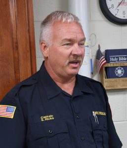 Steven Hicks, a captain with the Bristol Fire Department, talks with his crew.