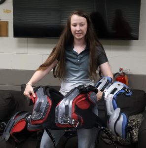 Dr. Emily Davis talks about shoulder pads with first responders.