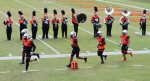 The Tusculum Band, in its new uniforms, welcomes the Tusculum football team on the field during the Homecoming game this year.