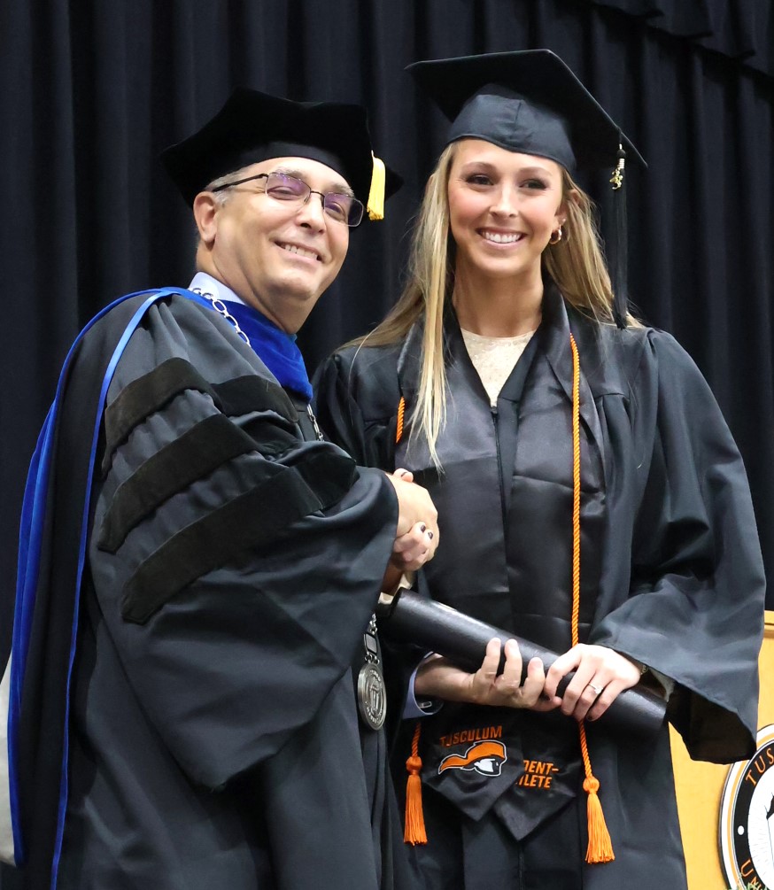 Dr. Scott Hummel, left, congratulates Grayson Patterson on her graduation 12-9-23.