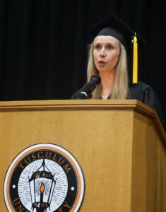Katie Love-Pride delivers remarks as the graduate student speaker.