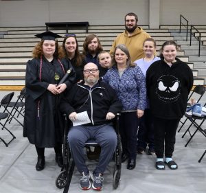 Zoey Seay, left, stands with her family after the ceremony.