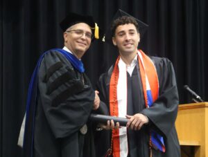Dr. Scott Hummel, left, congratulates Cristobal Morales.