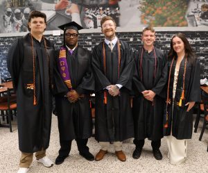 Environmental science students gather for a photo before the start of graduation.