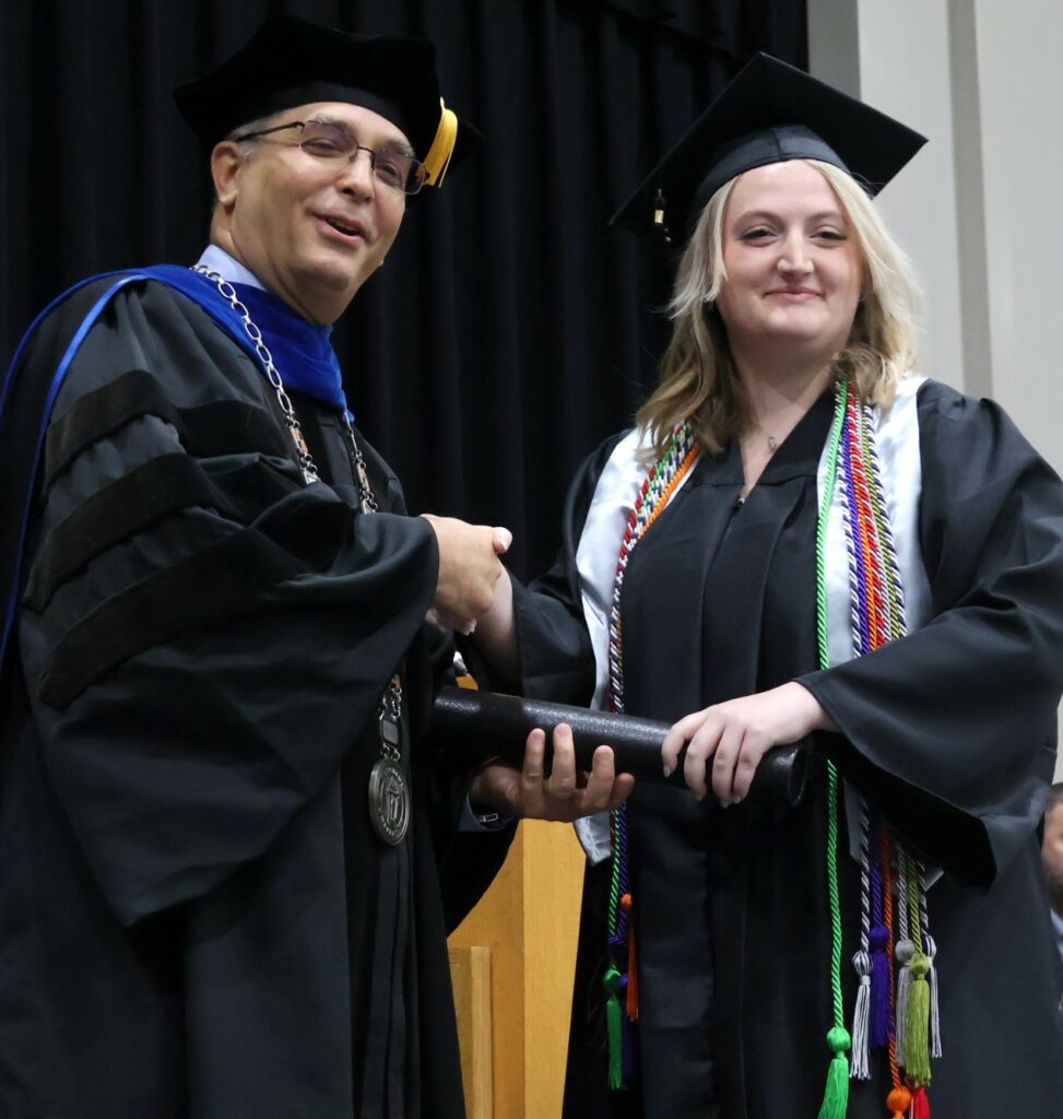 Dr. Scott Hummel, left, congratulates graduate Thea Allen on 12-9-23.