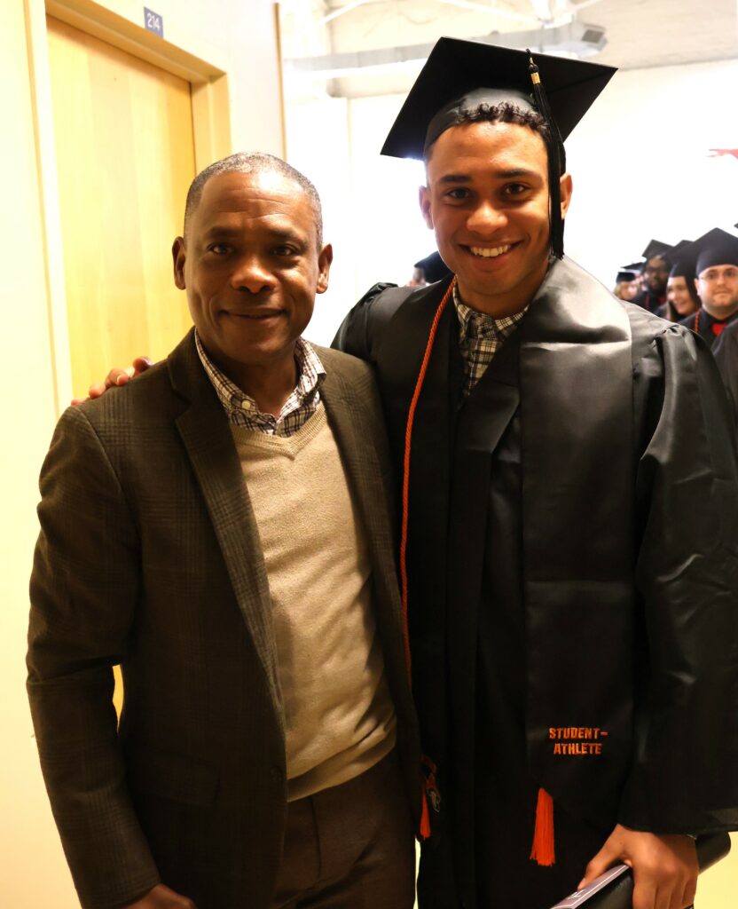 Allen Vital, Tusculum's men's soccer coach, takes a photo with his son, Jean-Pierre Elyze-Vital, who graduated from the university12-9-23.