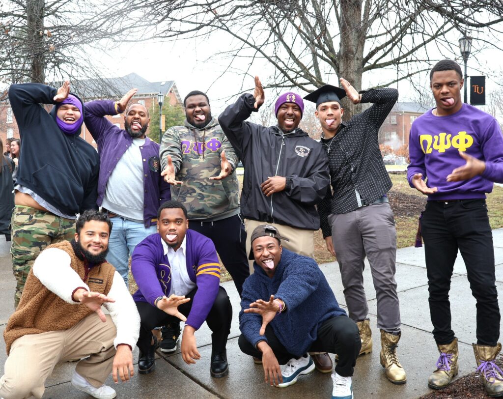 Members of Omega Psi Phi fraternity have fun after the 12-9-23 graduation ceremony.