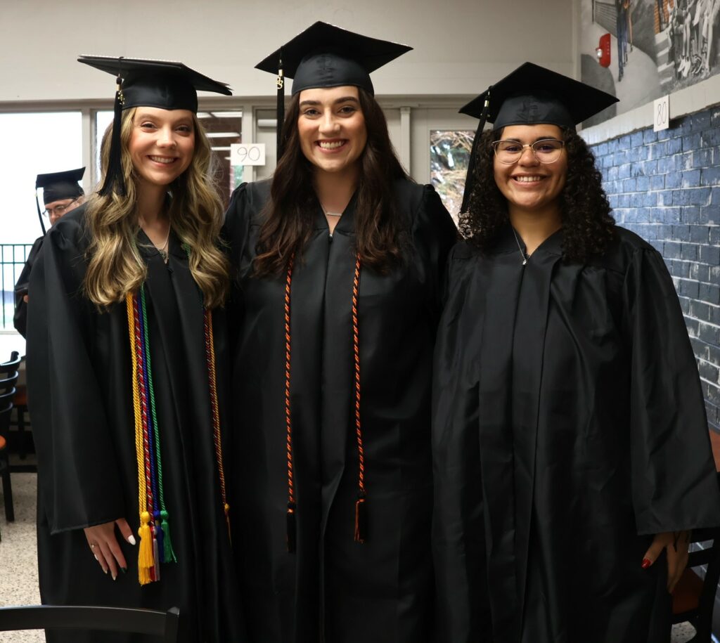 Graduates take time for a photo.