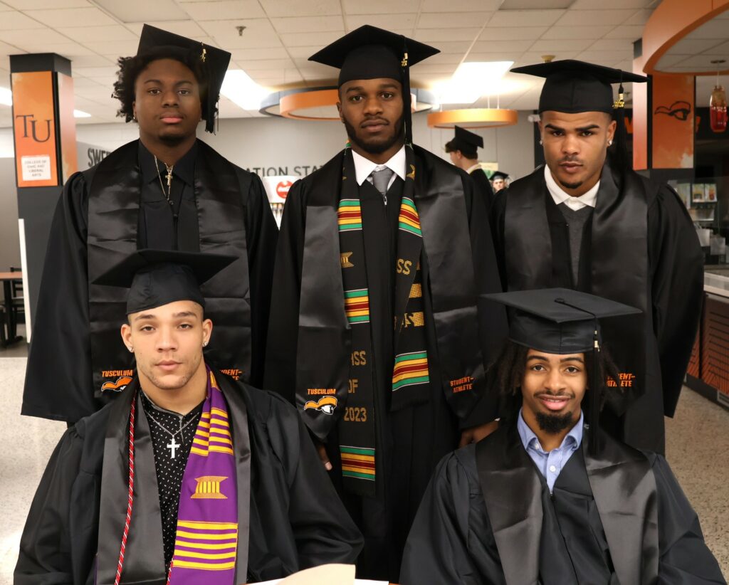 Graduates take time for a photo before the 12-9-23 commencement.